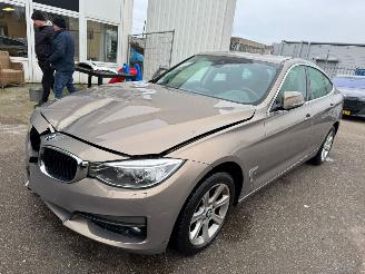 Damaged car BMW 3-serie Gran Turismo 320i Executive BJ 2014 202.816 KM 2014/1